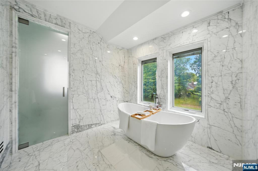 44 Floral Terrace Tenafly, NJ 07670 - Photo 29 of 49 a spacious bathroom with a bathtub and sink