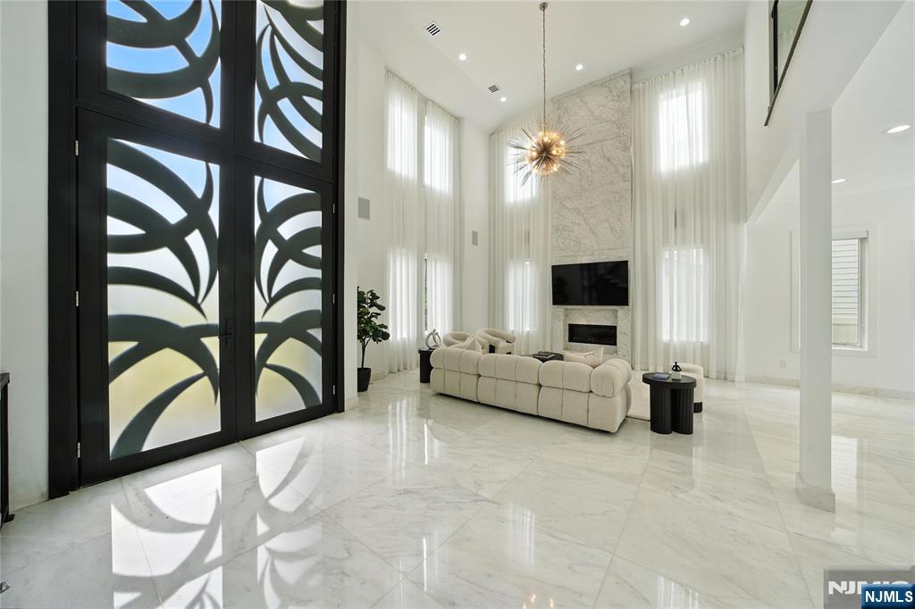 44 Floral Terrace Tenafly, NJ 07670 - Photo 3 of 49 a living room with furniture and a flat screen tv