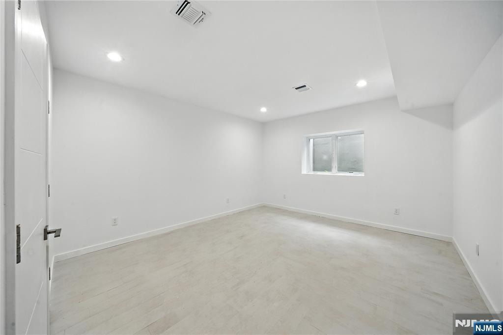 44 Floral Terrace Tenafly, NJ 07670 - Photo 37 of 49 an empty room with a empty space and windows