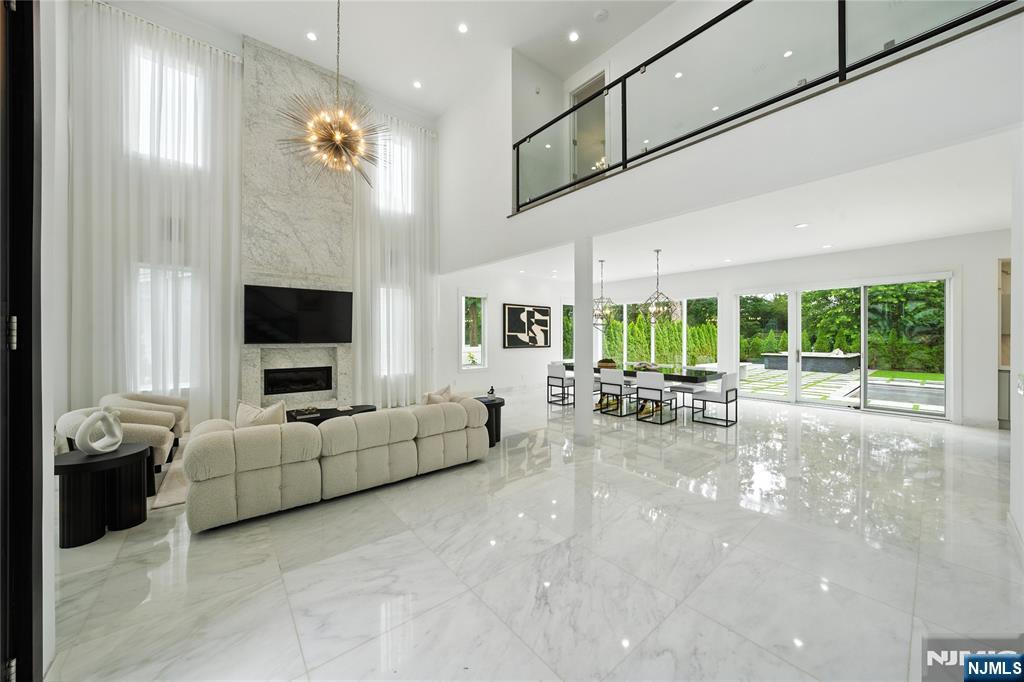 44 Floral Terrace Tenafly, NJ 07670 - Photo 6 of 49 a living room with furniture and a flat screen tv