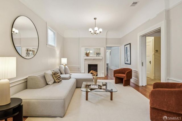 a kitchen with a stove a sink and a refrigerator