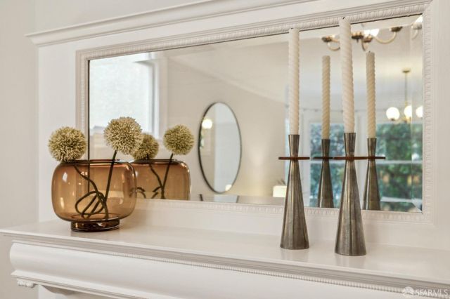 a bedroom with bed and a large window