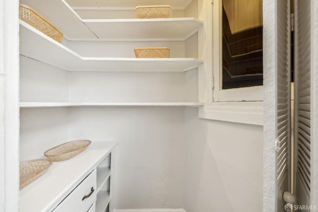 a bedroom with furniture and windows