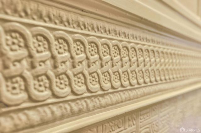 a bedroom with furniture and a large window