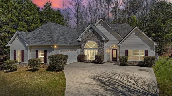 a front view of a house with a yard