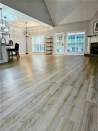 a view of a livingroom with workspace and a window