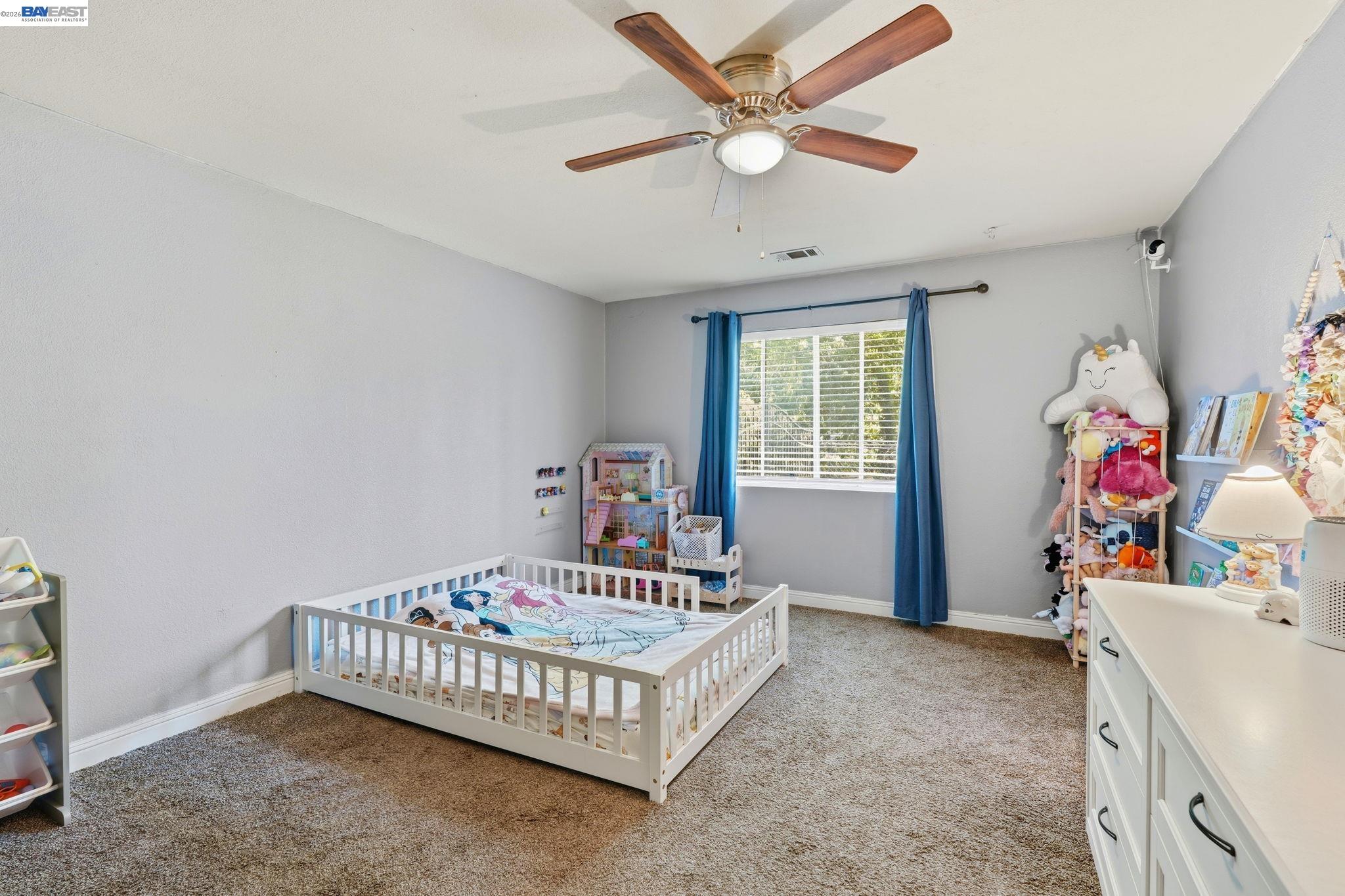 10378 South Priest Road French Camp, CA 95231 - Photo 22 of 44 a bedroom with a bed and a window