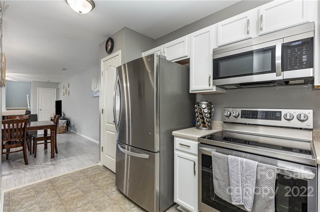 301 River Clay Road Fort Mill, SC 29708 - Photo 8 of 25 a kitchen with stainless steel appliances granite countertop a refrigerator stove and microwave