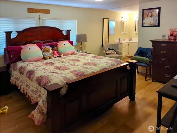 a bedroom with a bed and a dresser