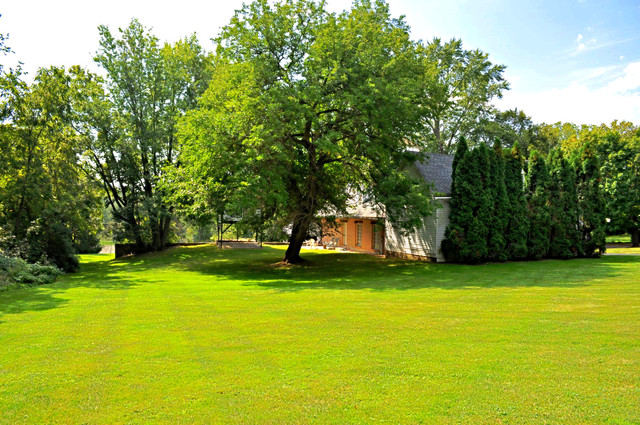 36W841 Crane Road St. Charles, IL 60174 - Photo 22 of 25 a view of a trees in front of a house with a yard