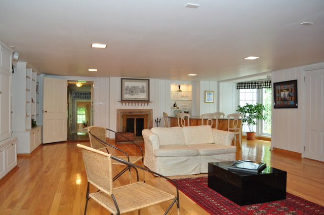 36W841 Crane Road St. Charles, IL 60174 - Photo 7 of 25 a living room with fireplace furniture and a wooden floor