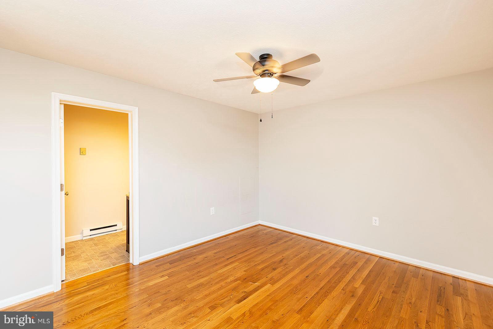 174 Double Church Road Stephens City, VA 22655 - Photo 18 of 29 a view of empty room with wooden floor