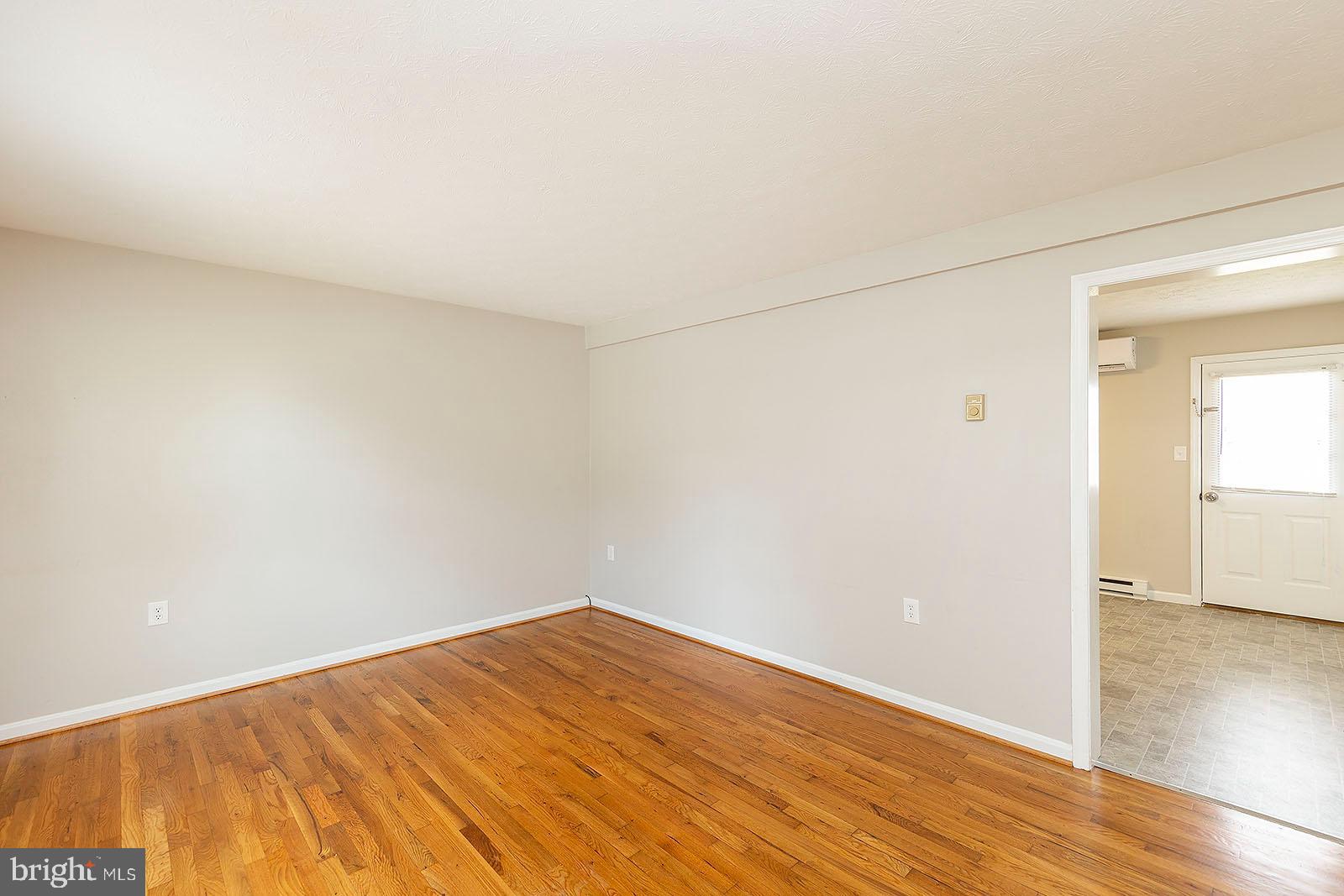 174 Double Church Road Stephens City, VA 22655 - Photo 2 of 29 a view of empty room with wooden floor