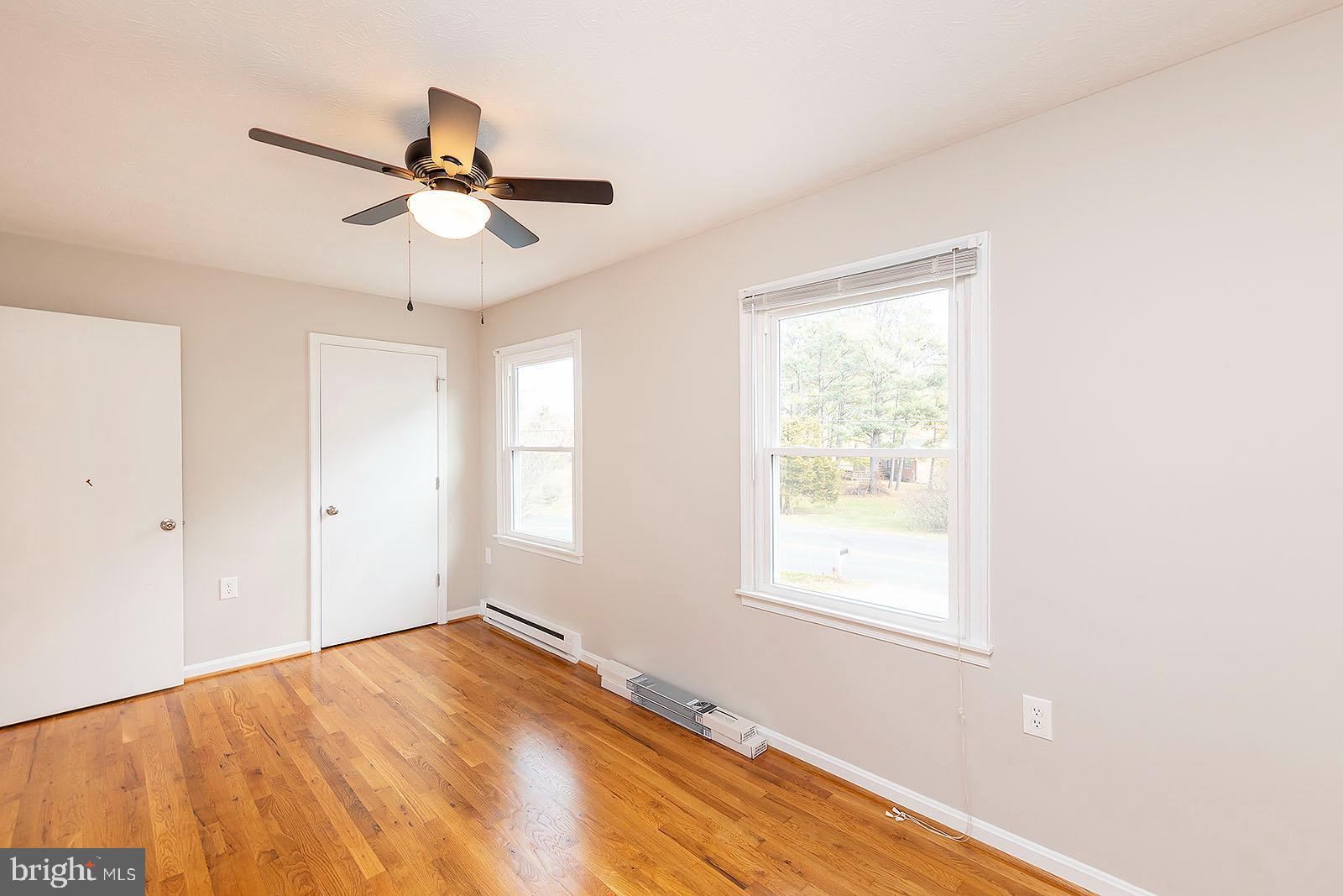 174 Double Church Road Stephens City, VA 22655 - Photo 23 of 29 a view of empty room with wooden floor and fan