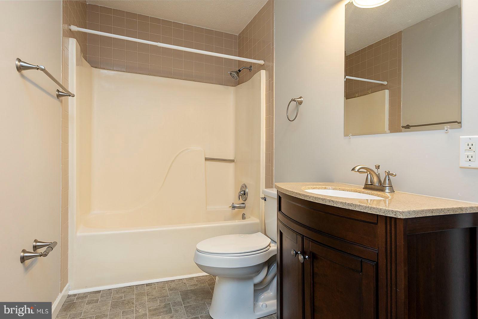 174 Double Church Road Stephens City, VA 22655 - Photo 24 of 29 a bathroom with a sink a toilet and shower