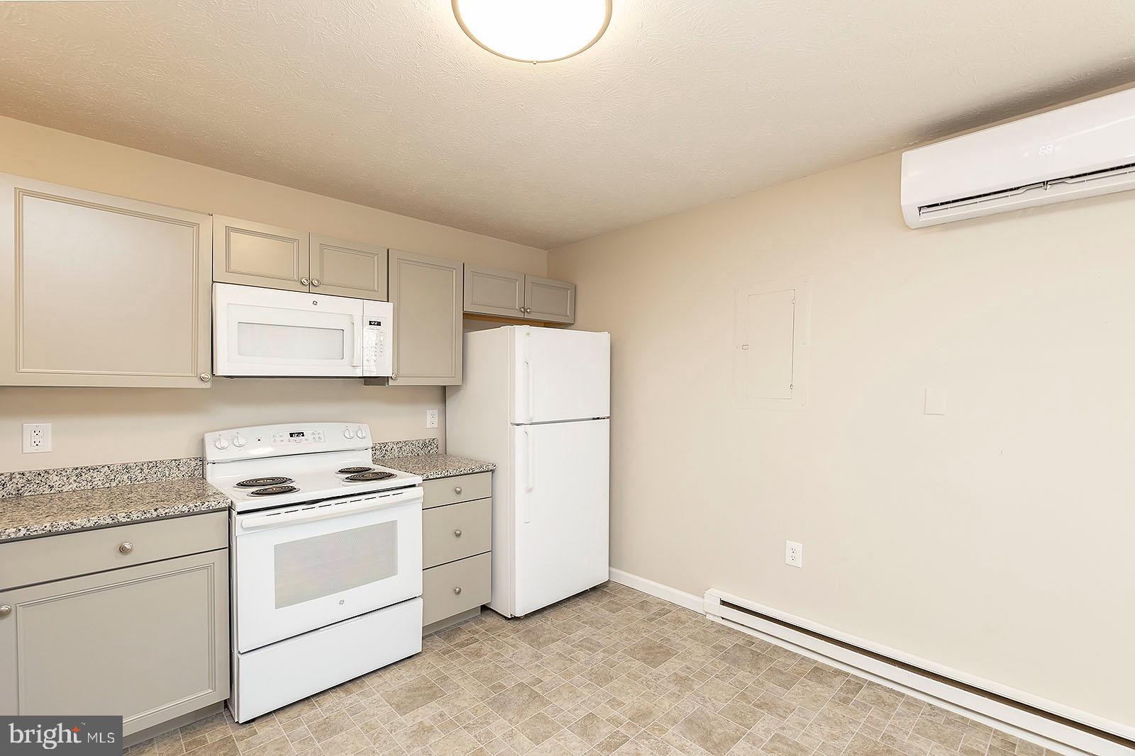 174 Double Church Road Stephens City, VA 22655 - Photo 10 of 29 a kitchen with white cabinets and white appliances