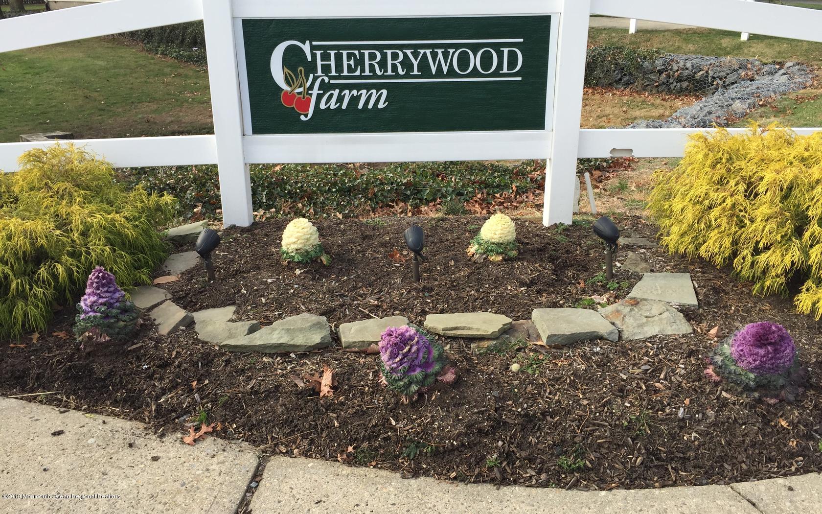 2 Cherrywood Circle, Unit 102 Brick, NJ 08724 - Photo 18 of 26 a sign that is on the side of the road