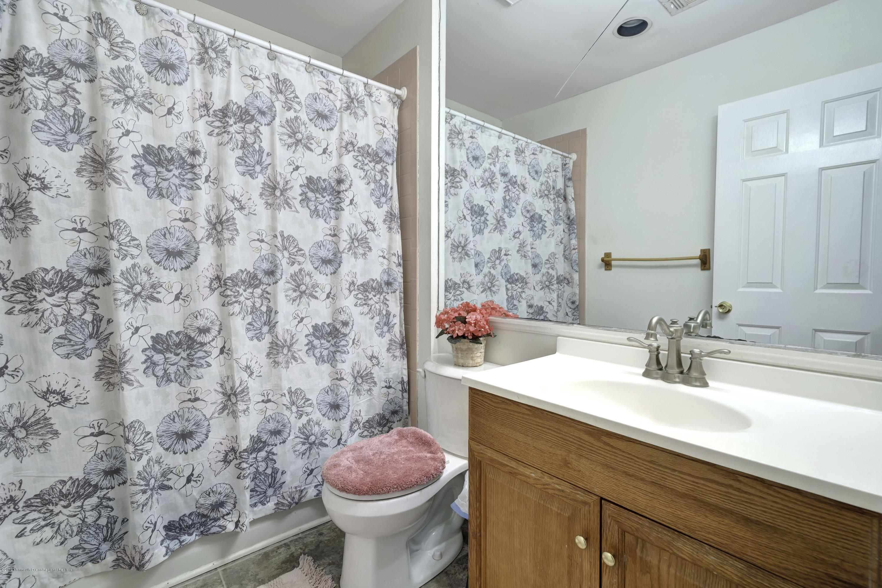 2 Cherrywood Circle, Unit 102 Brick, NJ 08724 - Photo 19 of 26 a bathroom with a sink and a toilet
