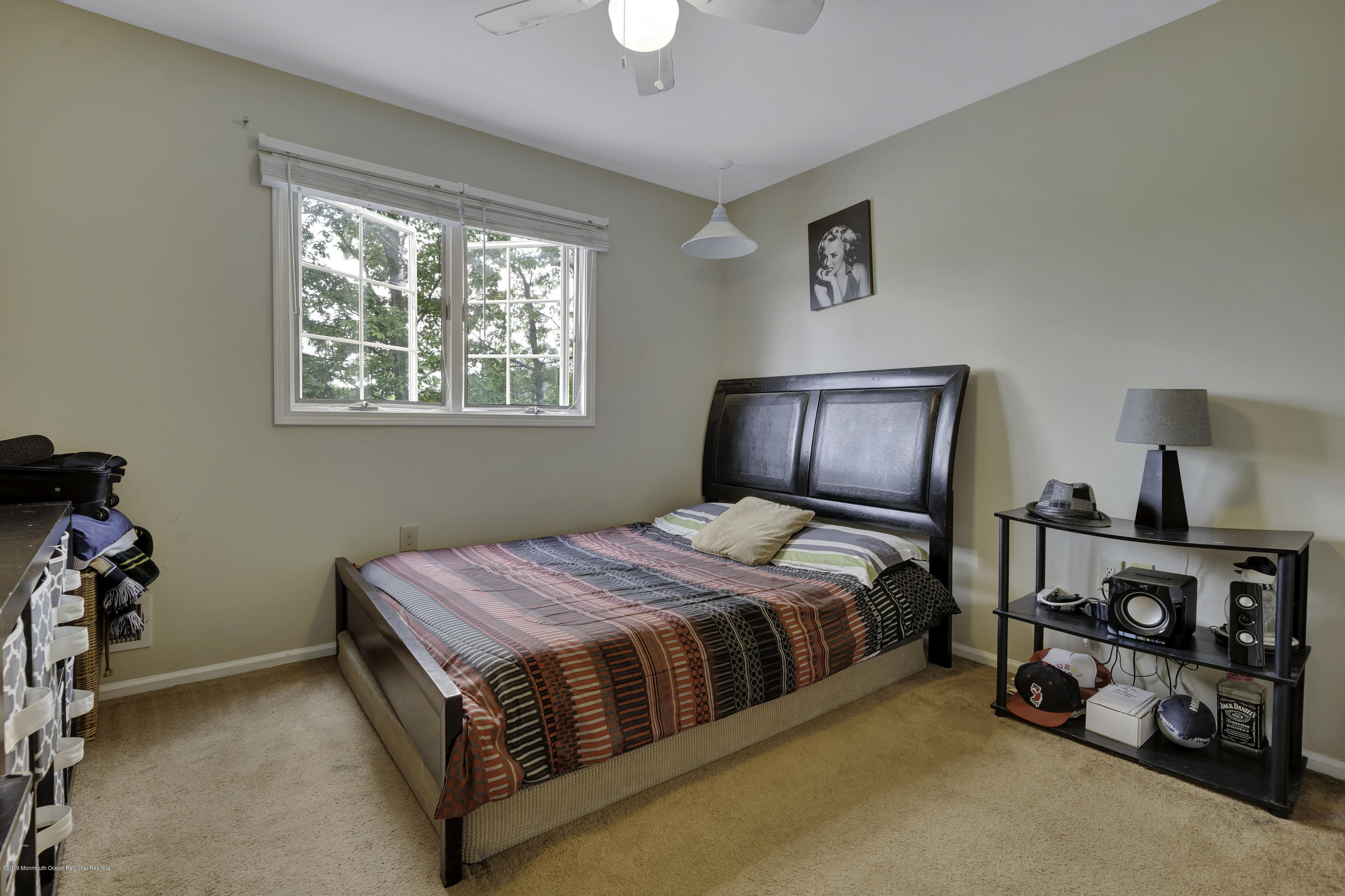 2 Cherrywood Circle, Unit 102 Brick, NJ 08724 - Photo 21 of 26 a bedroom with a bed and a window