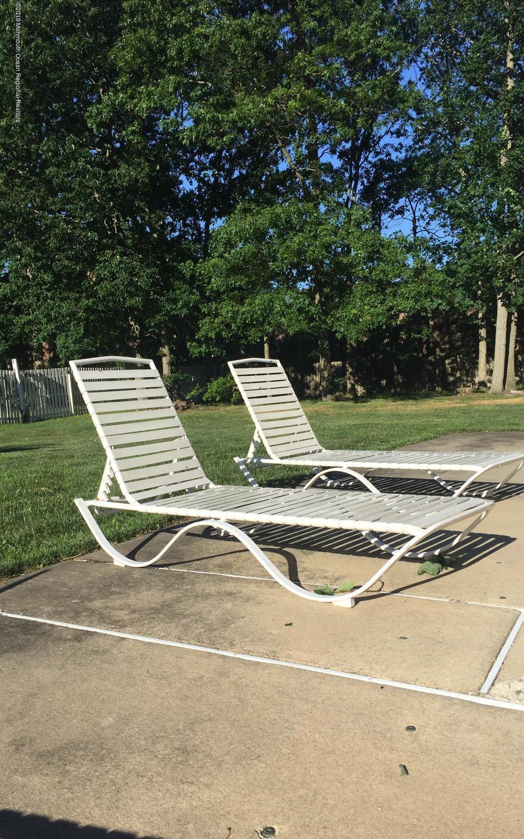 2 Cherrywood Circle, Unit 102 Brick, NJ 08724 - Photo 26 of 26 a view of a tennis ground with large trees