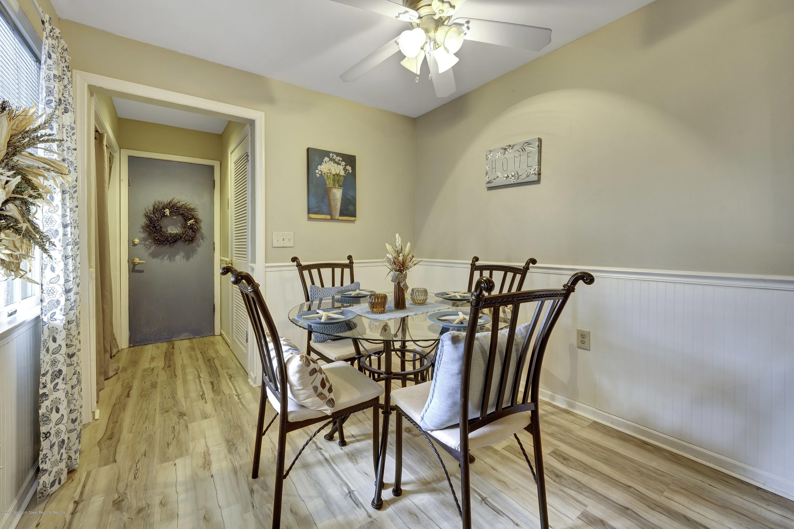 2 Cherrywood Circle, Unit 102 Brick, NJ 08724 - Photo 5 of 26 a view of a dining room with furniture and chandelier