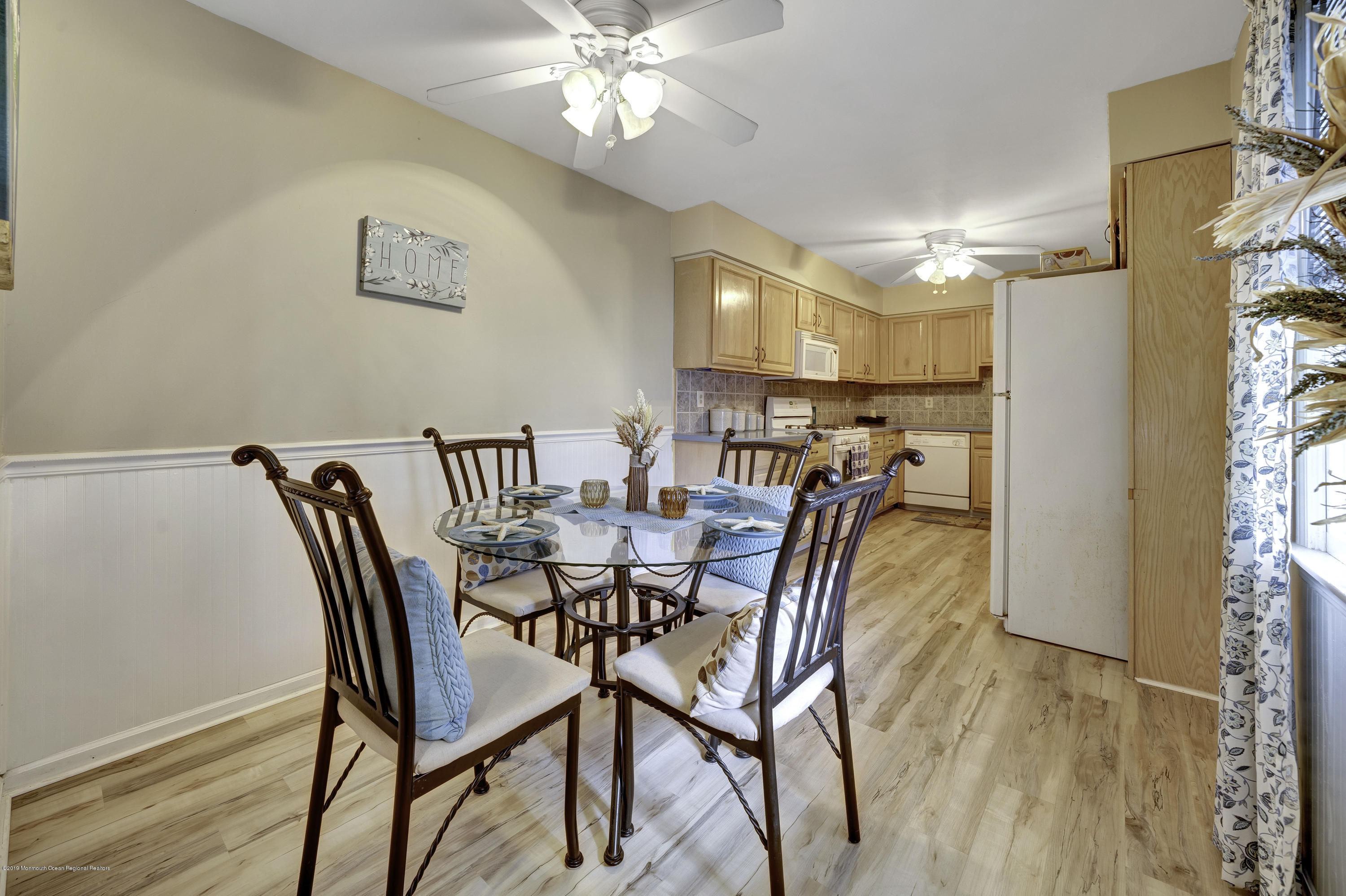 2 Cherrywood Circle, Unit 102 Brick, NJ 08724 - Photo 6 of 26 a view of a dining room with furniture and chandelier