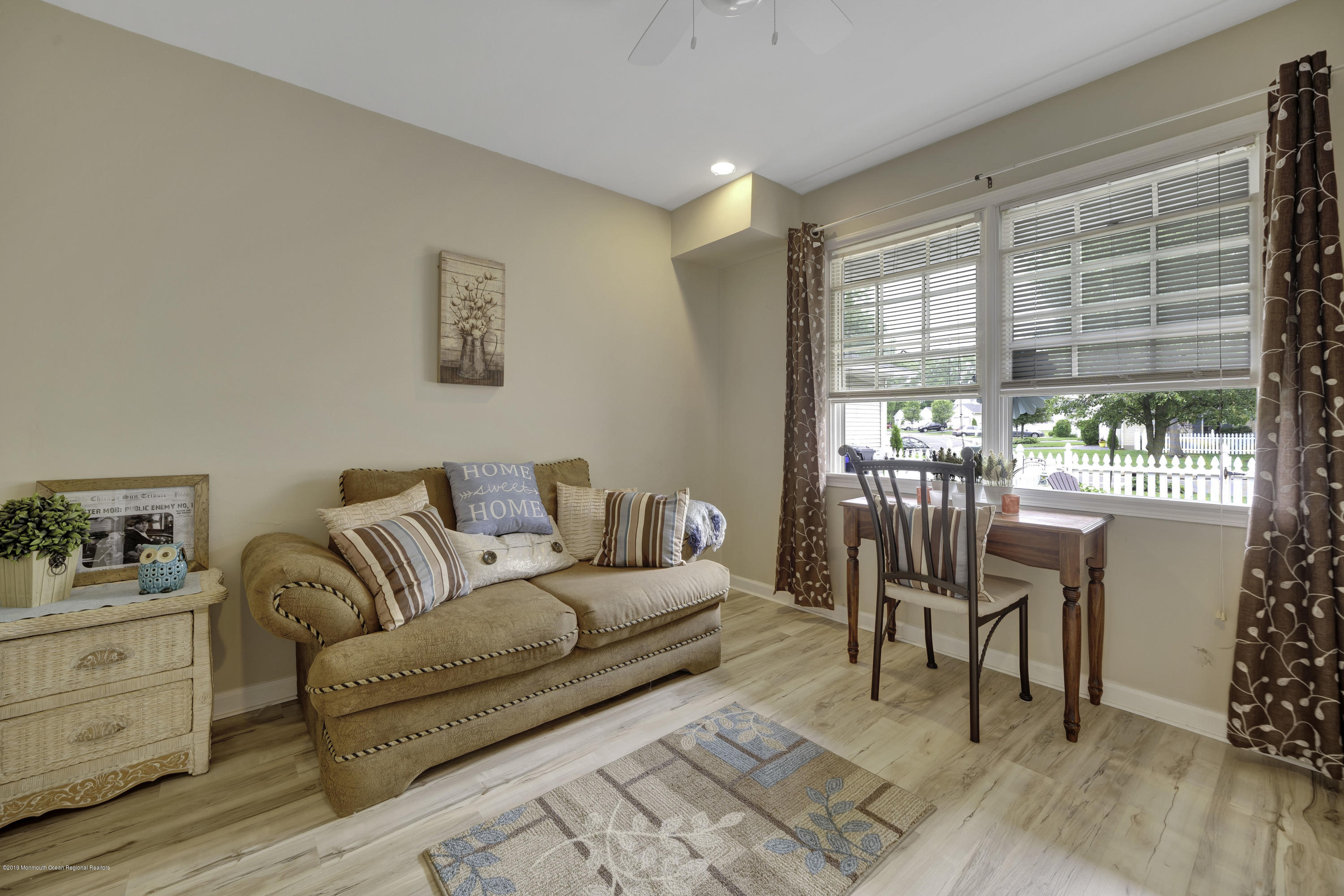 2 Cherrywood Circle, Unit 102 Brick, NJ 08724 - Photo 7 of 26 a living room with furniture and a large window