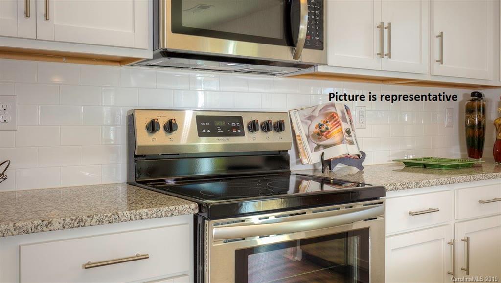 8008 Starnes Randall Road Charlotte, NC 28215 - Photo 12 of 25 a stove top oven sitting inside of a kitchen