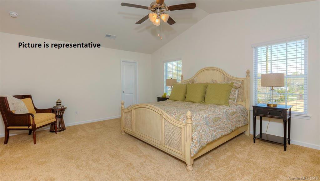 8008 Starnes Randall Road Charlotte, NC 28215 - Photo 14 of 25 a bedroom with a bed chair and window