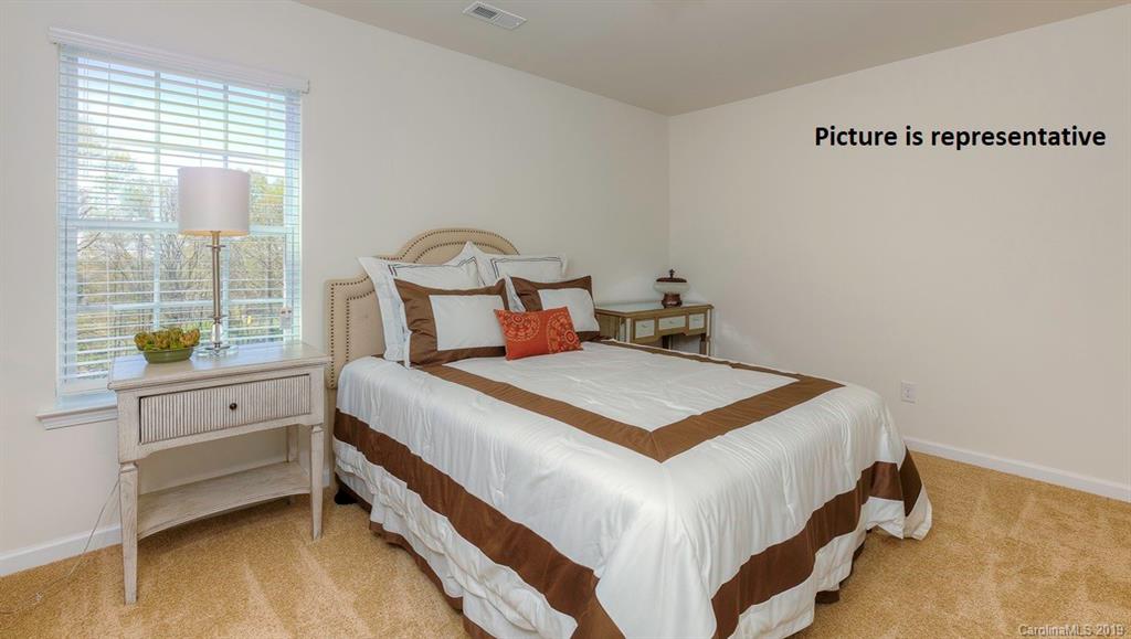 8008 Starnes Randall Road Charlotte, NC 28215 - Photo 19 of 25 a bedroom with a bed and a window