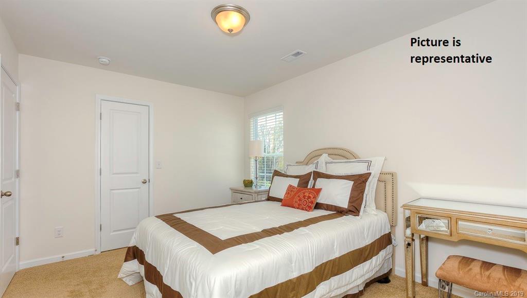 8008 Starnes Randall Road Charlotte, NC 28215 - Photo 20 of 25 a bedroom with a bed and window
