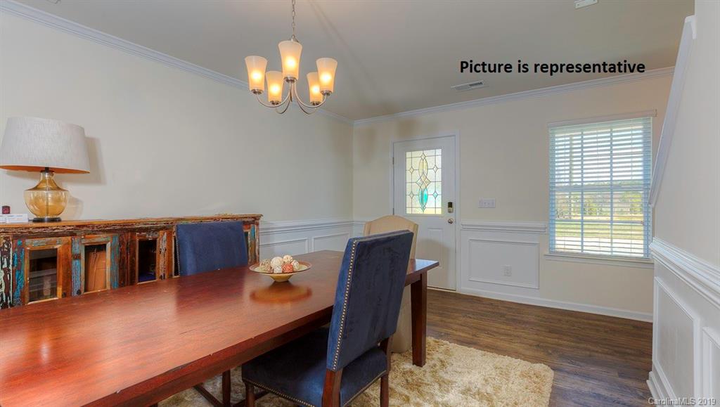 8008 Starnes Randall Road Charlotte, NC 28215 - Photo 3 of 25 a view of a dining room with furniture and wooden floor