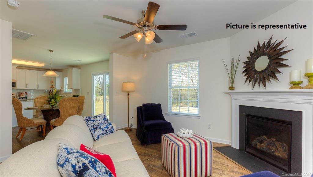 8008 Starnes Randall Road Charlotte, NC 28215 - Photo 5 of 25 a living room with furniture and a fireplace