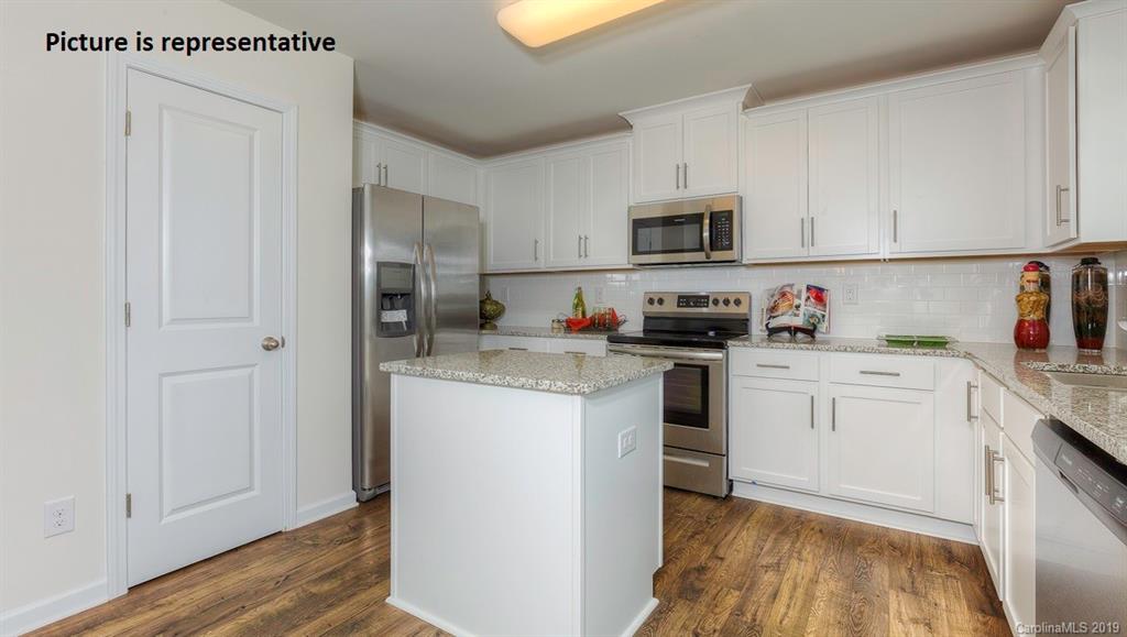 8008 Starnes Randall Road Charlotte, NC 28215 - Photo 8 of 25 a kitchen with stainless steel appliances granite countertop a refrigerator sink and white cabinets