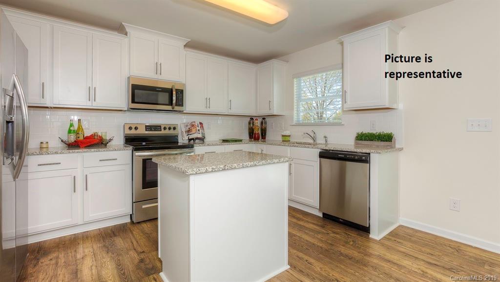 8008 Starnes Randall Road Charlotte, NC 28215 - Photo 9 of 25 a kitchen with granite countertop white cabinets and white appliances