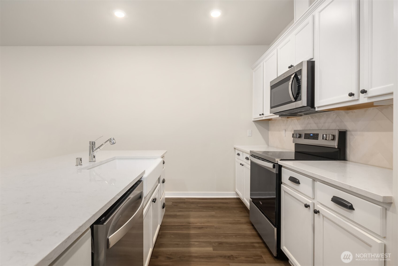 31840 Myrtle Street Carnation, WA 98014 - Photo 11 of 22 a kitchen with stainless steel appliances a sink and a stove