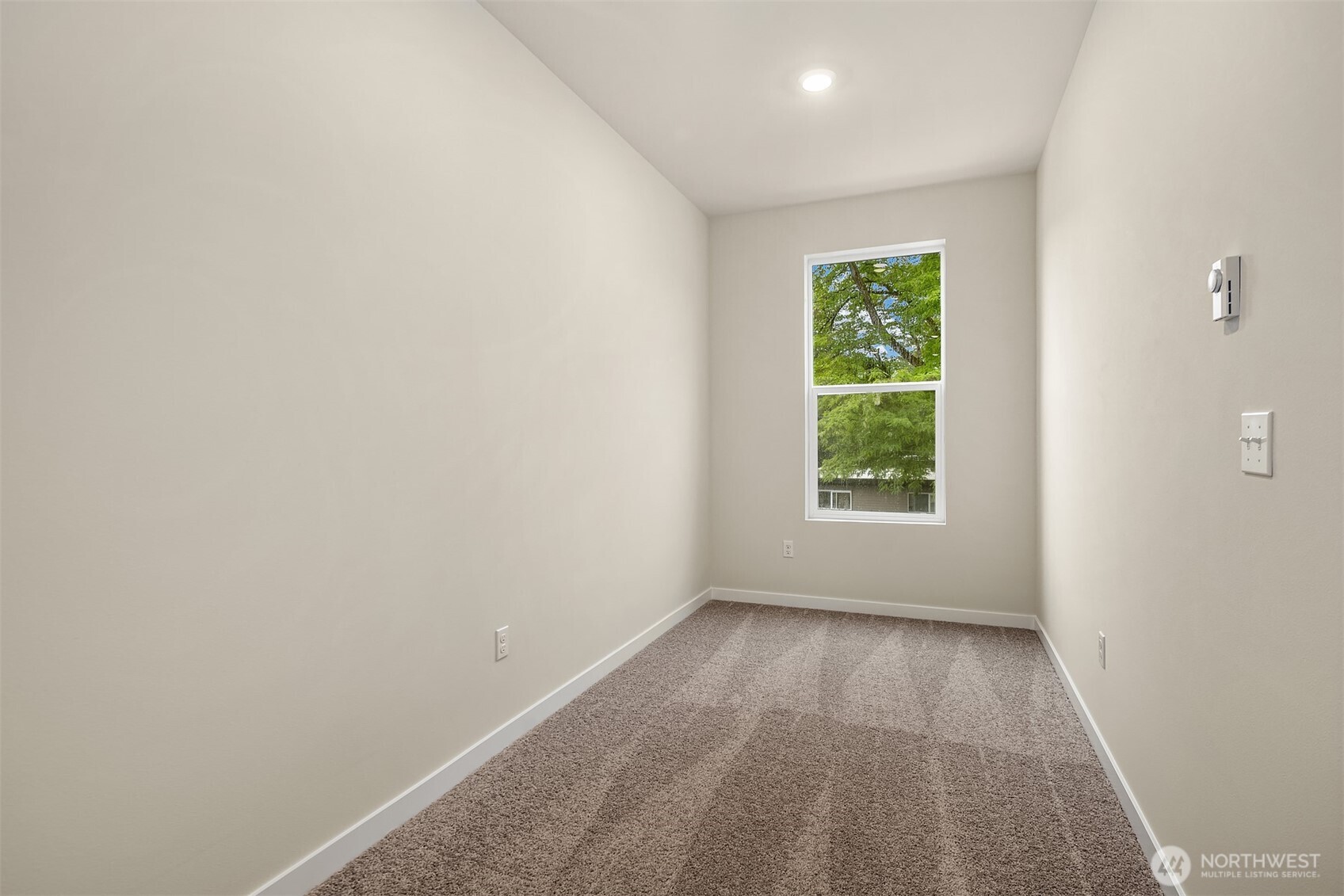31840 Myrtle Street Carnation, WA 98014 - Photo 18 of 22 an empty room with wooden floor and windows