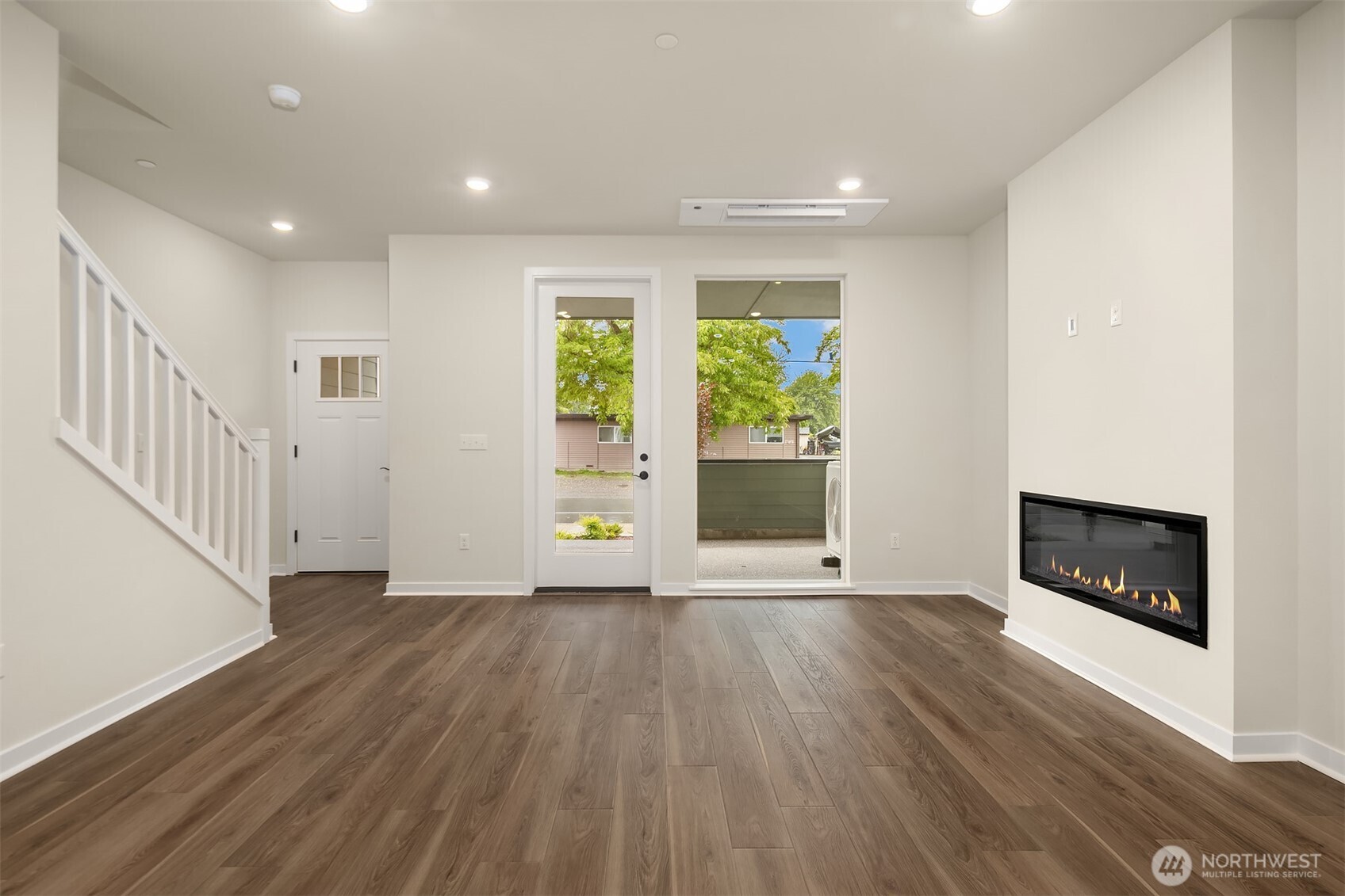 31840 Myrtle Street Carnation, WA 98014 - Photo 10 of 22 a view of an empty room with a fireplace and a window