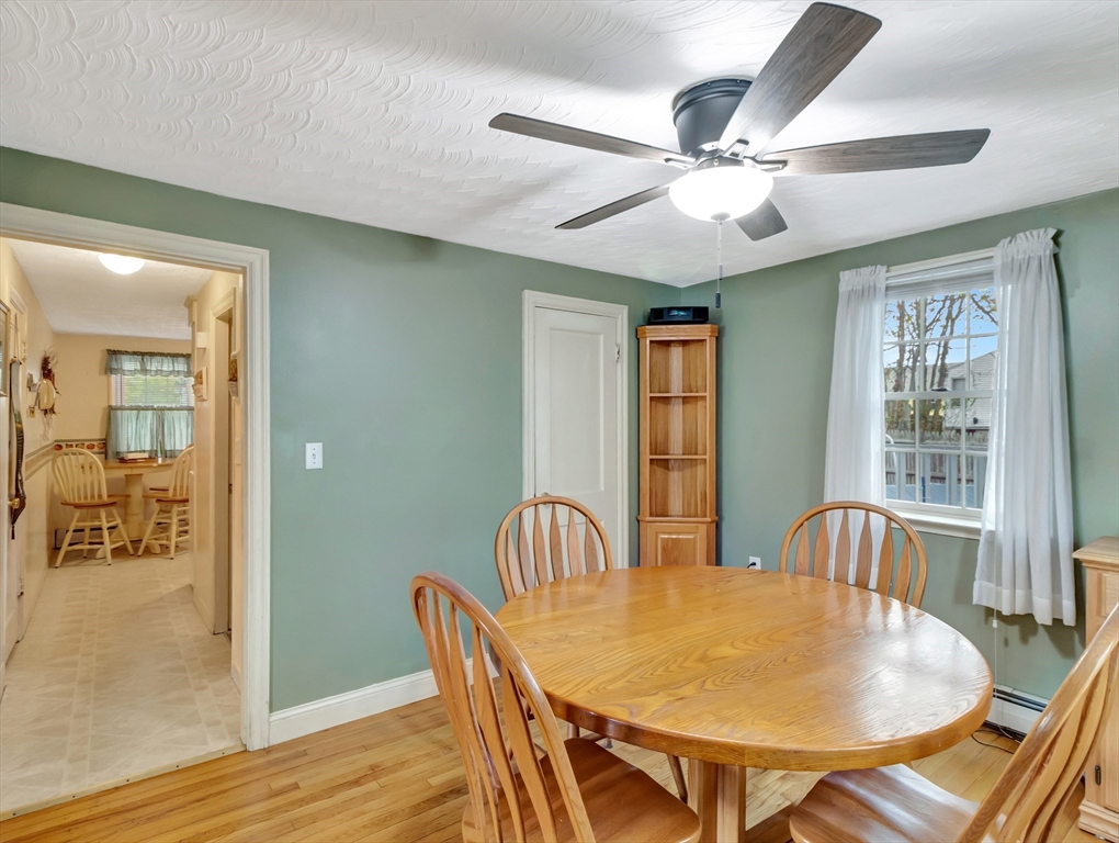 5 G Street Hull, MA 02045 - Photo 16 of 41 a view of a dining room with furniture and wooden floor