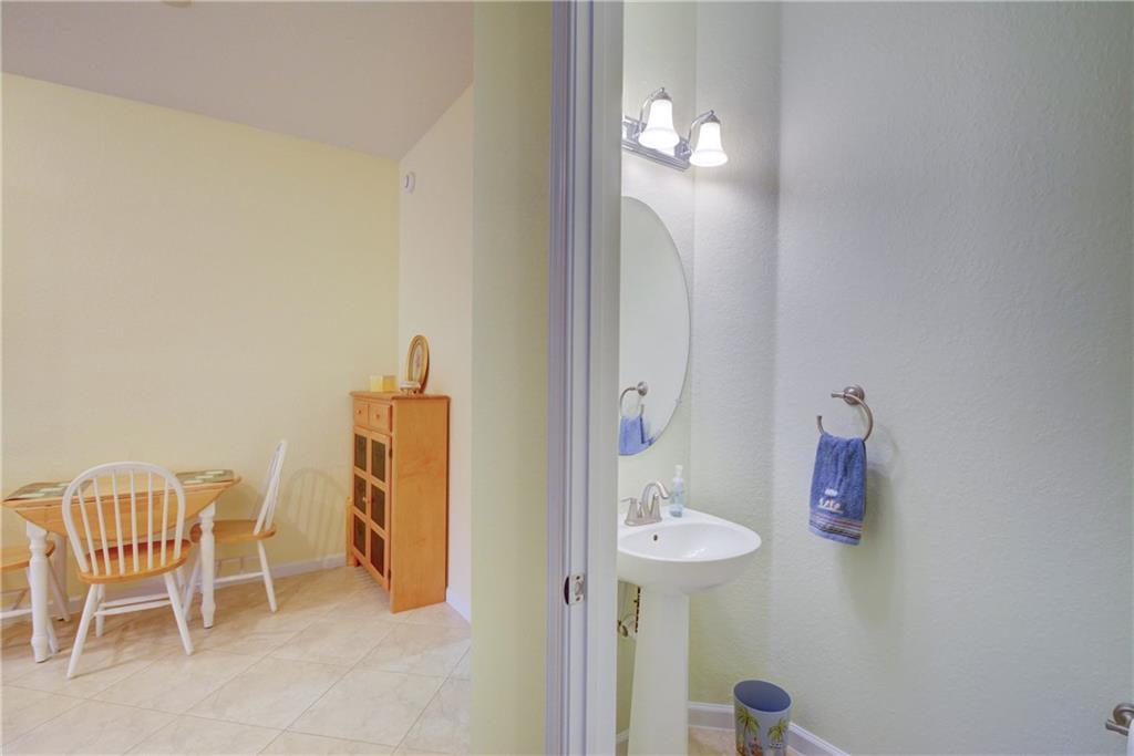138 Southwest Walking Path Stuart, FL 34997 - Photo 20 of 50 a bathroom with a sink and a mirror