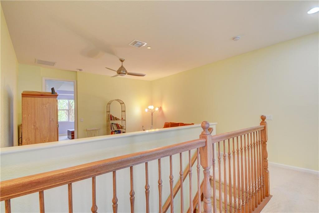 138 Southwest Walking Path Stuart, FL 34997 - Photo 21 of 50 a bedroom with a bed and a large mirror with window