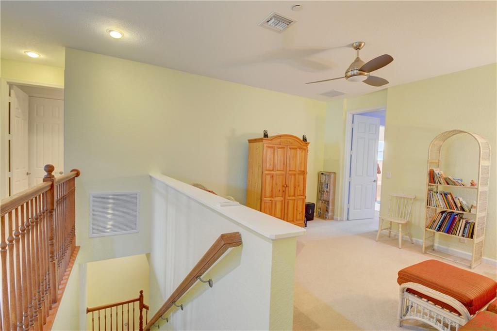 138 Southwest Walking Path Stuart, FL 34997 - Photo 22 of 50 a view of a hallway with a couch