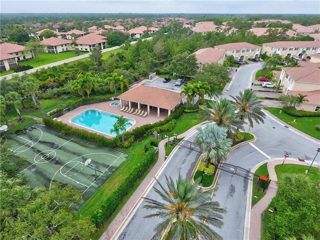 138 Southwest Walking Path Stuart, FL 34997 - Photo 3 of 50 an aerial view of a house with a garden and lake view
