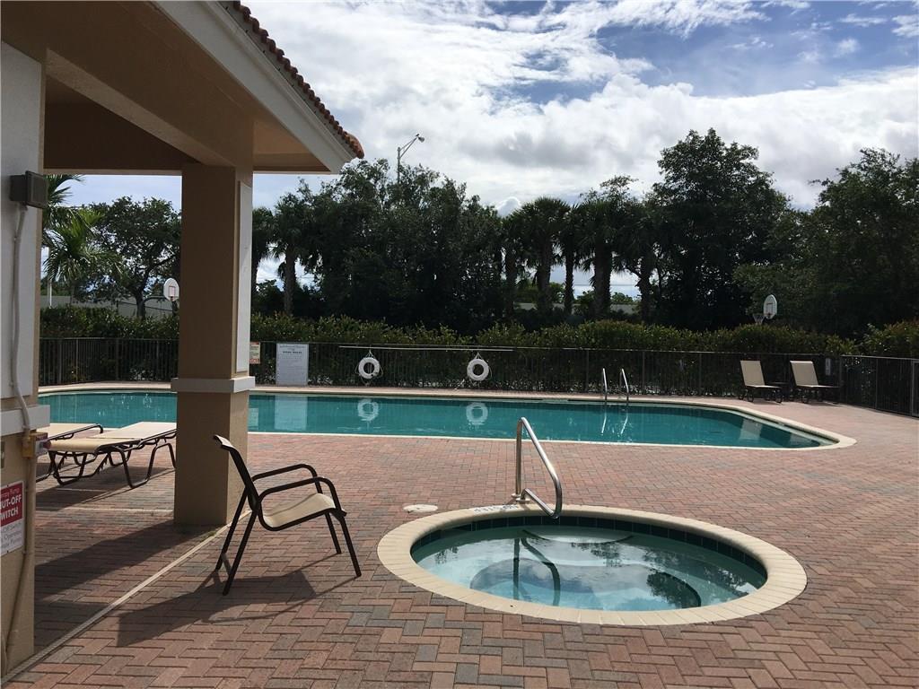 138 Southwest Walking Path Stuart, FL 34997 - Photo 45 of 50 a view of a swimming pool with a yard