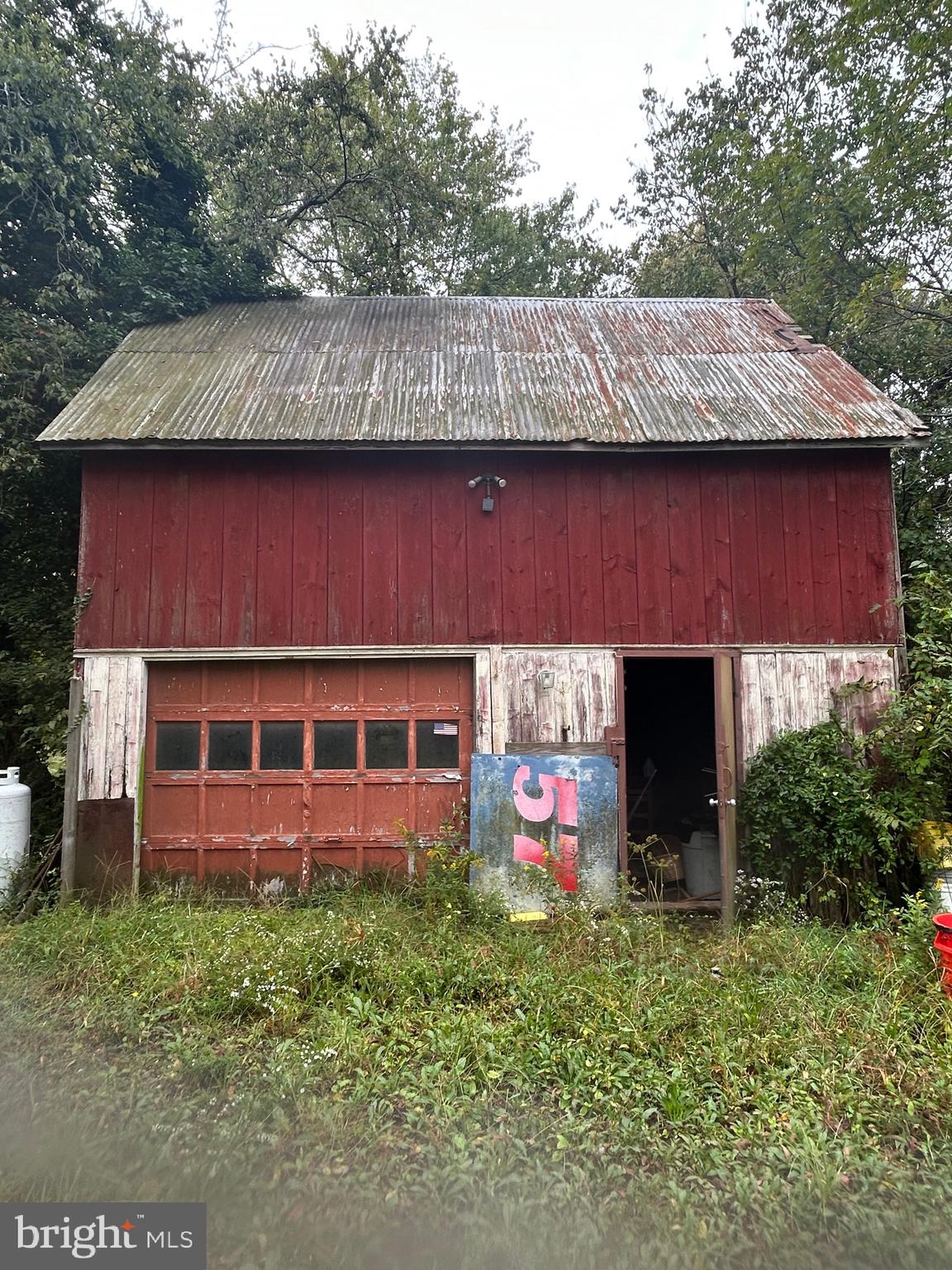 912 Main Street Port Norris, NJ 08349 - Photo 12 of 18 a view of brick house with a yard and large tree