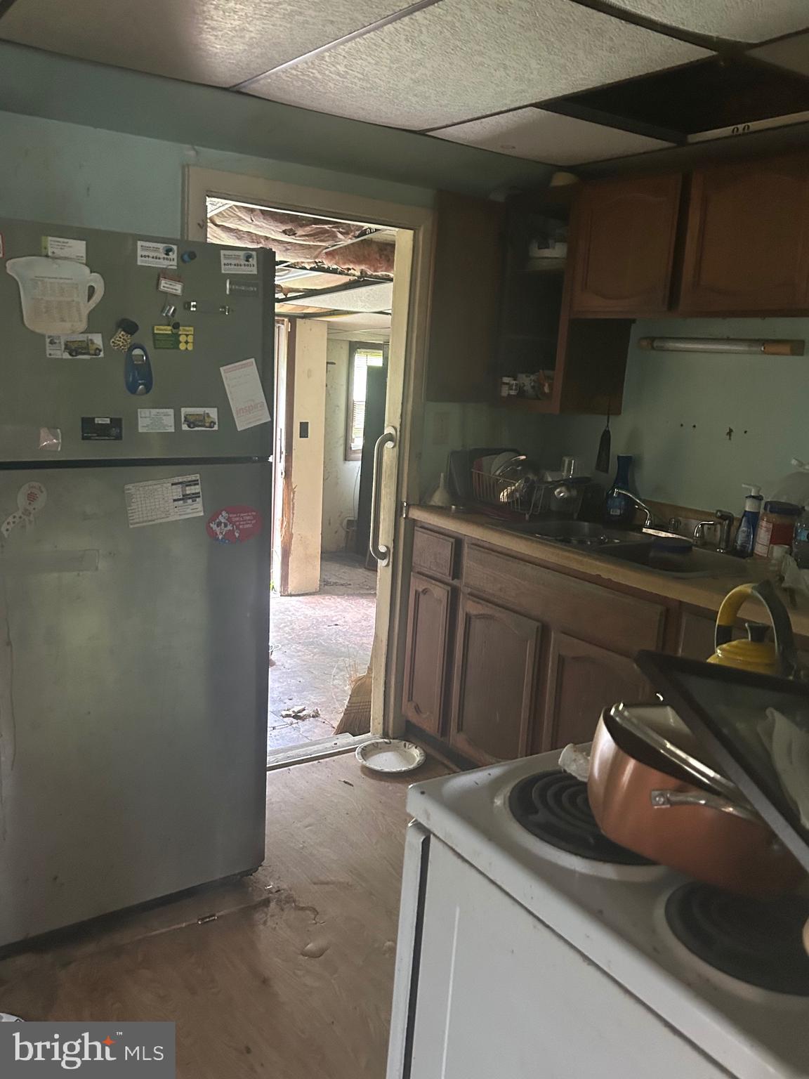 912 Main Street Port Norris, NJ 08349 - Photo 2 of 18 a kitchen with a sink and refrigerator