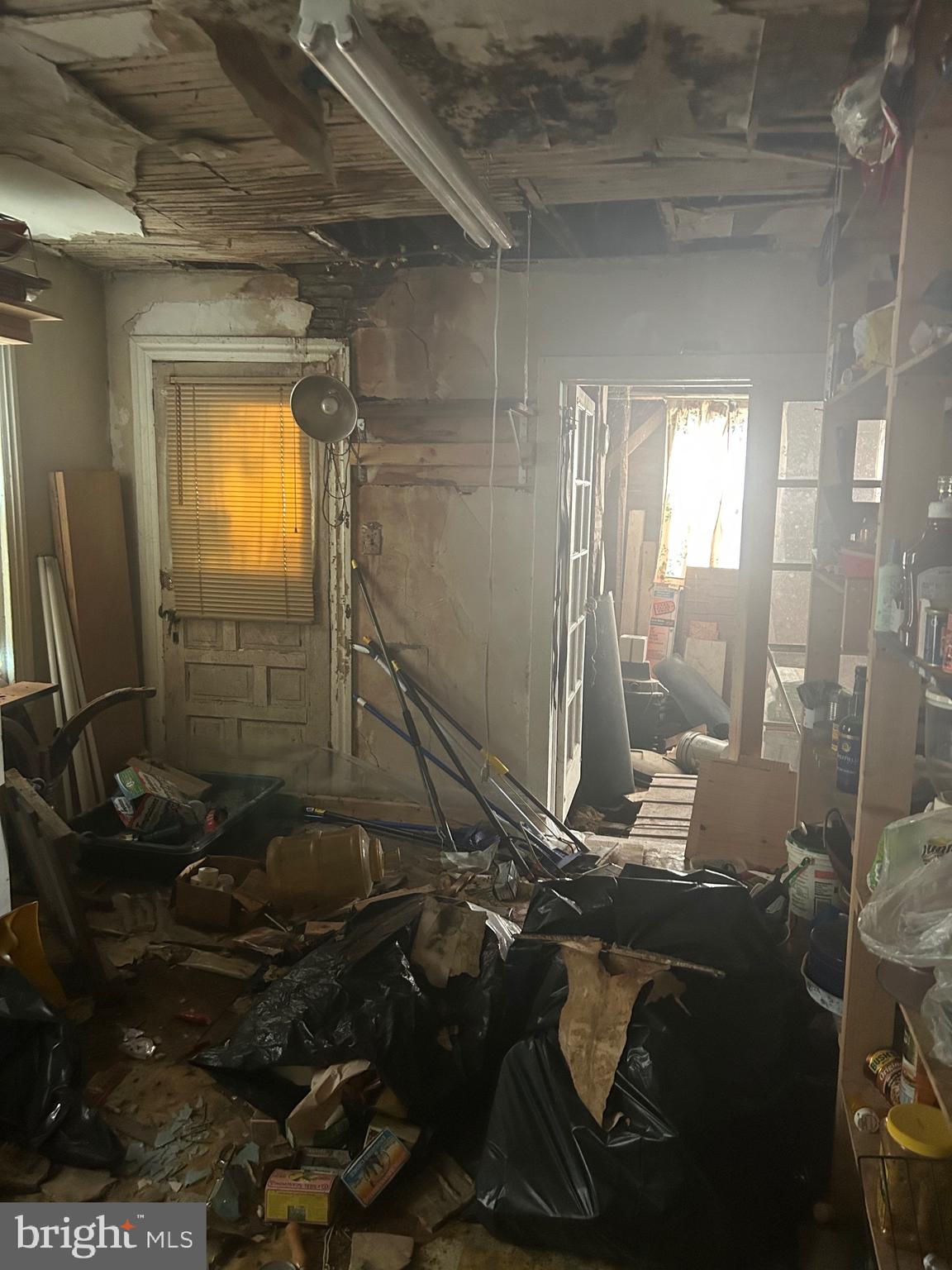 912 Main Street Port Norris, NJ 08349 - Photo 6 of 18 a bathroom with a granite countertop sink a mirror and shower