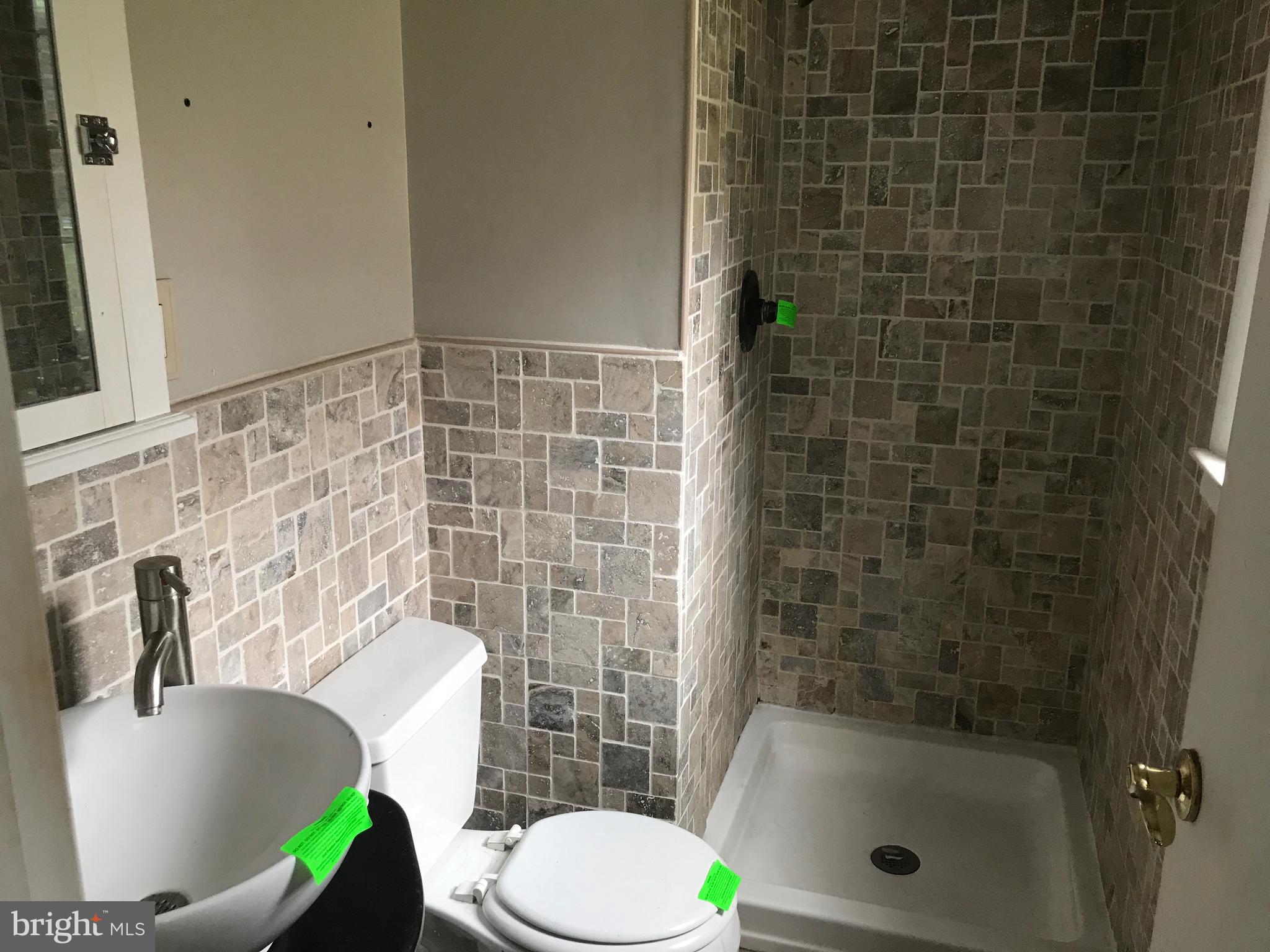 2117 Woodview Road Finksburg, MD 21048 - Photo 7 of 19 a bathroom with a sink and toilet