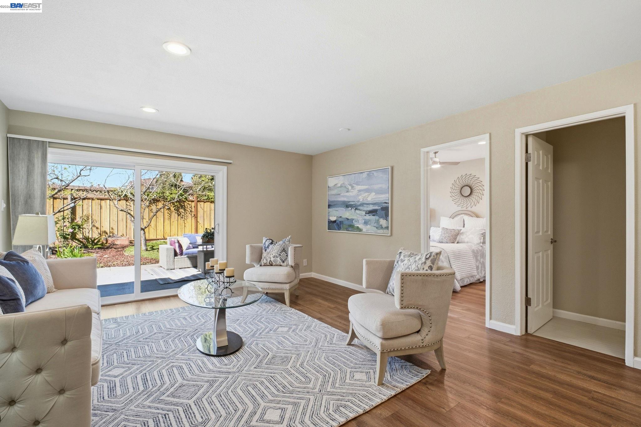 595 Seville Place Fremont, CA 94539 - Photo 14 of 43 a living room with furniture and wooden floor