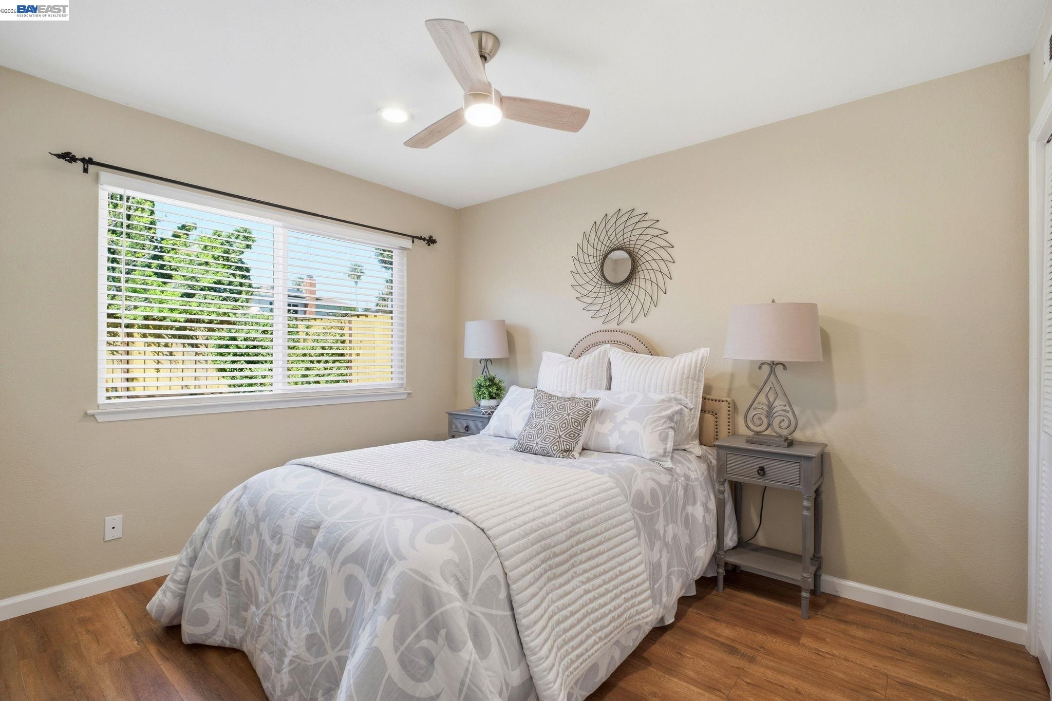 595 Seville Place Fremont, CA 94539 - Photo 15 of 43 a bedroom with bed and a window